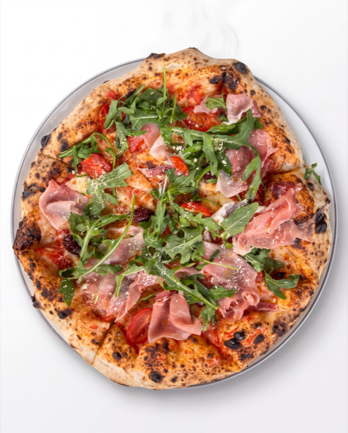 Pizza Crudo z prosciutto crudo i rukolą — Pizzeria Ogrodowa w Wieluniu